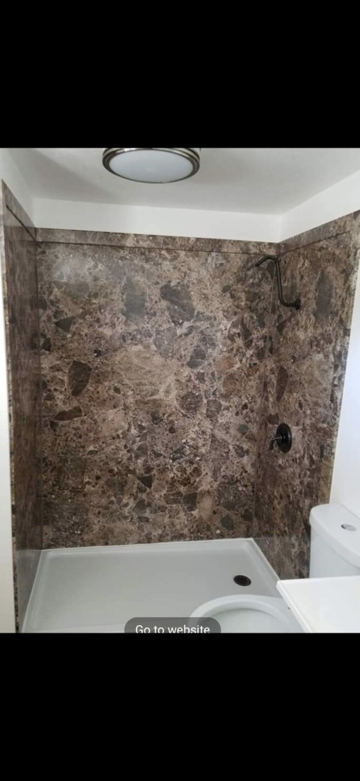 Finished dark stone-look FlexStone shower